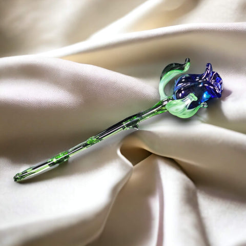 a green and blue flower on a white cloth