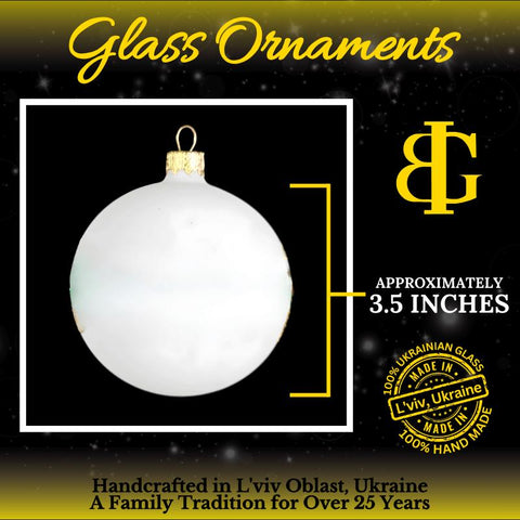 a glass ornament with a white ball hanging from it