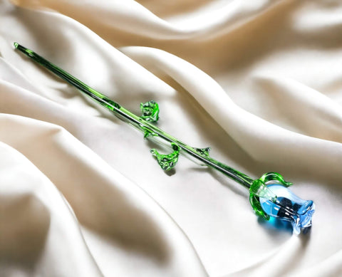 a close up of a flower on a white cloth