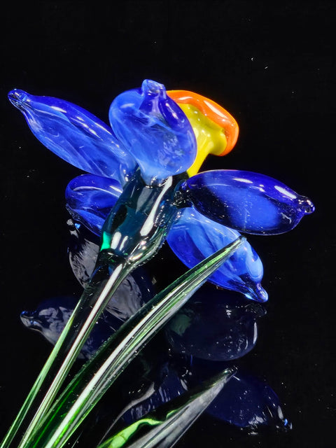 a close up of a vase with flowers in it