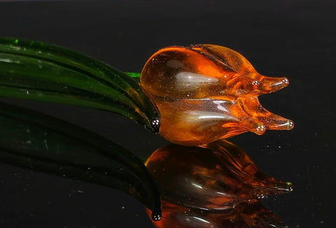 a glass animal sitting on top of a table